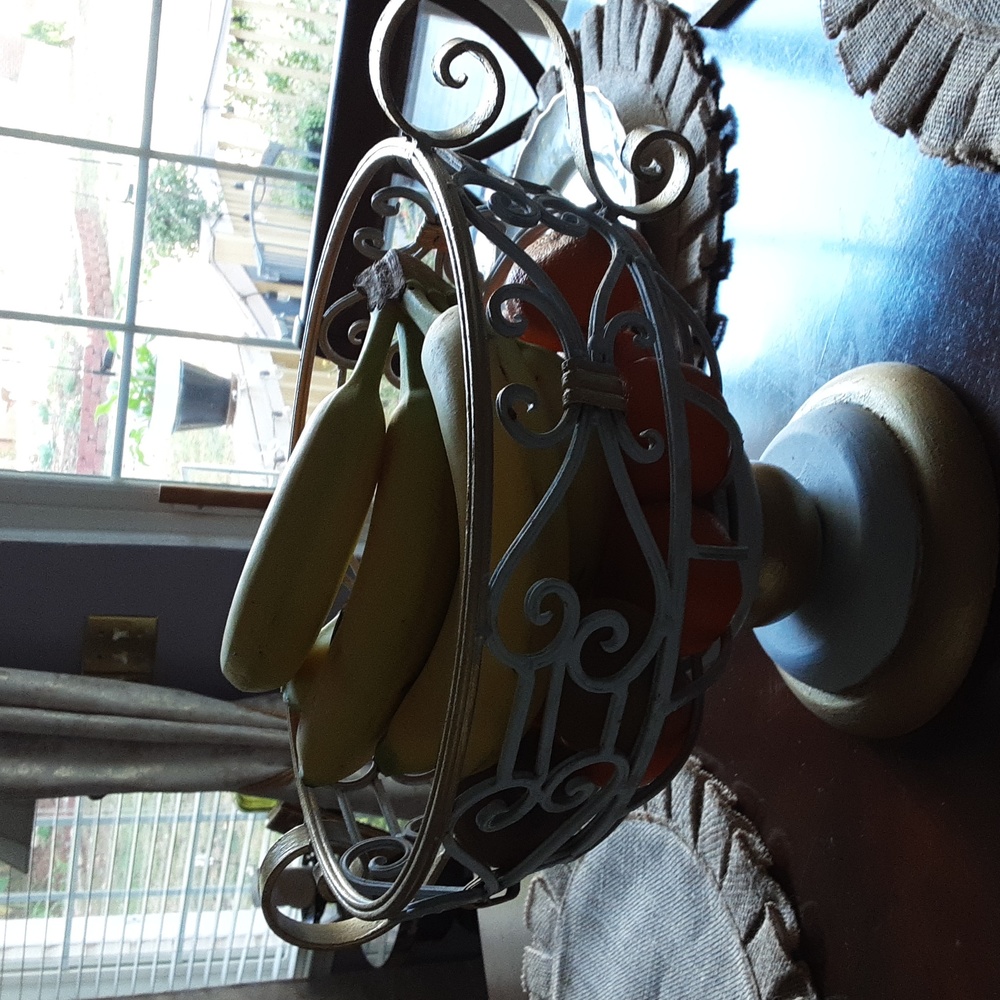 Wrought iron pedestal fruit bowl 10" inches tall X 12" inches wide.